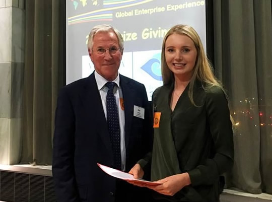 BCom student Kate Burn with Victoria Business School Dean Profesor Bob Buckle after accepting the top award at the Global Enterprise Experience business competition